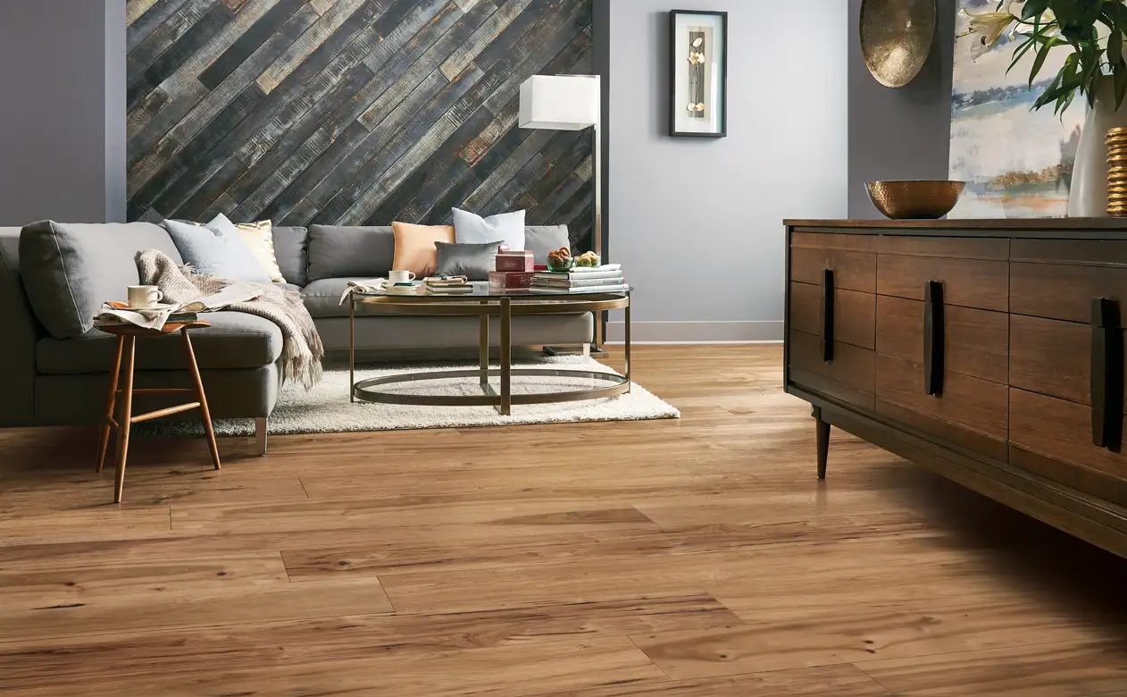 Living room with soft grey furniture and hardwood floors